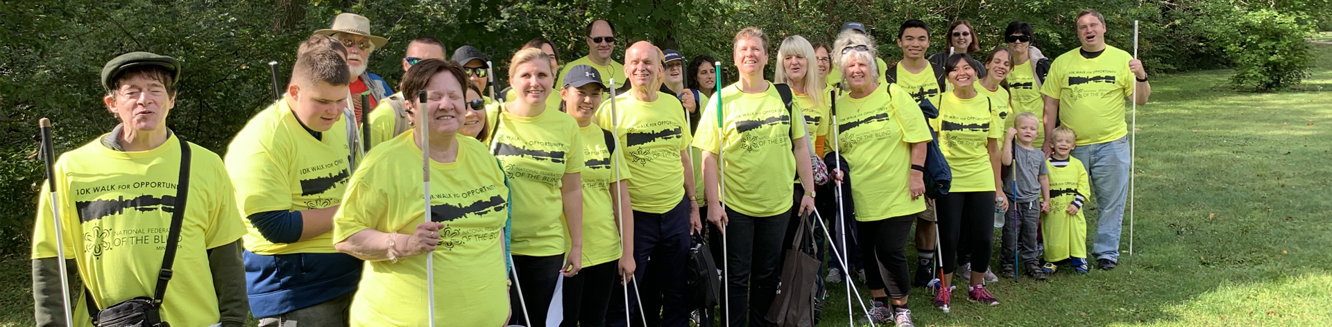 NFB of Minnesota members smile together for a photograph before they start thier 10K walk for opportunity.